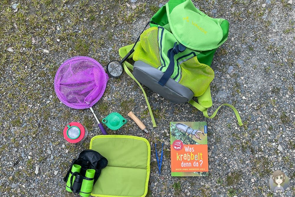 Inhalt vom Entdeckerrucksack auf dem Camping Harfenmühle